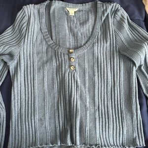 Ruffle bottom. Blue long sleeve.